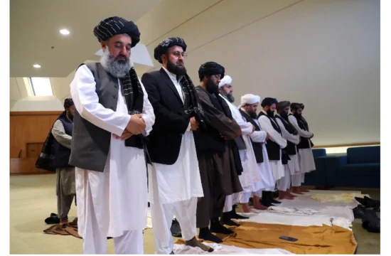 Taliban delegation praying