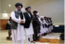 Taliban delegation praying